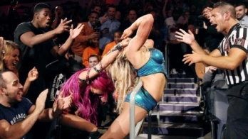 The Queen bows to The Boss in Falls Count Anywhere Match