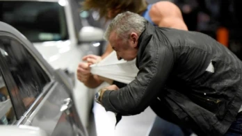 AJ Styles hurls Shane McMahon through a car window