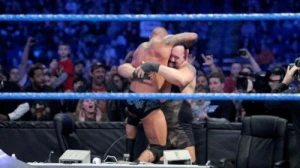 Bryan's disqualification victory incites a brawl between The Viper and Big Show