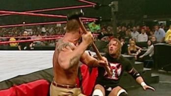 Randy Orton introduces Triple H to a sledgehammer