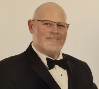 Patrick D Baker