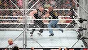 Triple H and Brock Lesnar brawl inside a Steel Cage